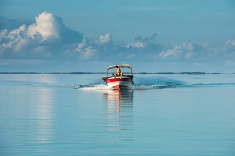 Boat in the waters of Tikehau
