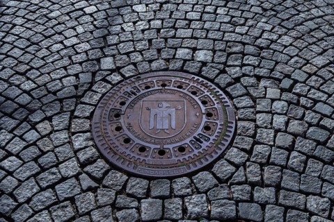 Manhole cover with Munchner Kindl
