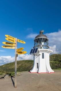 Lighthouse with signposts at Cape Reinga