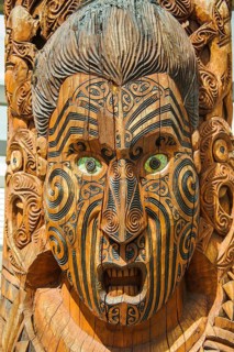 Traditional wood carved mask in the Te Puia Maori Cultural Center