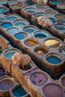 Worker dyeing leather