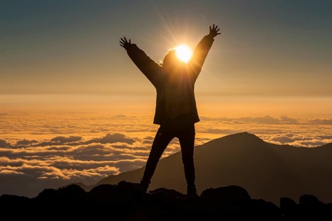 Tourist in backlight waiting for sunset on top of Haleakala National Park
