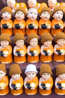Monk toy puppets on display at the evening market