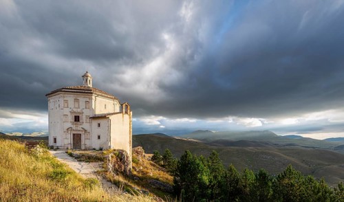 Church Santa Maria della Pieta with mountain massif Gran Sasso