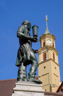 Goldsmith fountain and church tower of Annakirche