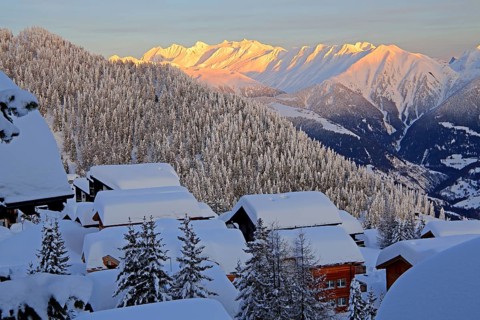 View over deeply snow-covered chalets into the Rhone valley to the Blinnenhorn 3374m and Oberrappenhorn 3176m