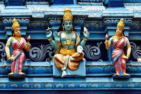 Colorful Hindu temple decorated with figures and gods