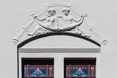 Relief and stained-glass windows on a town house