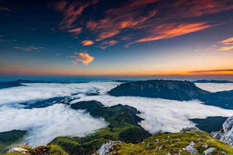 Mountain peak with sea of fog at sunrise