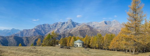 View of Monte Cersogno and Pelvo di Elva in autumn with chapel Chiesa San Giovanni