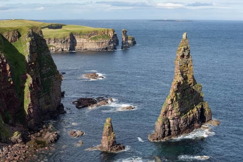 Rugged coastal landscape with the rock spikes Duncansby Stacks