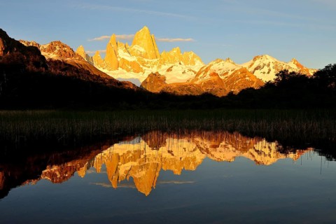Mountain range with Cerro Fitz Roy at sunrise reflected in Lago de Los Tres