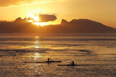 Sea kayaks on the sea at sunset