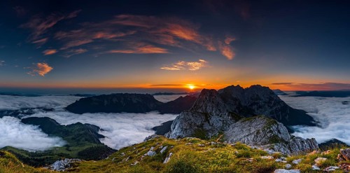 Mountain peak with sea of fog at sunrise