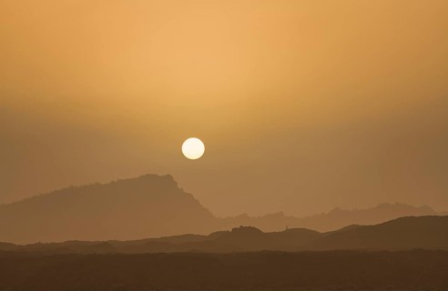 Sunset with mountain silhouette