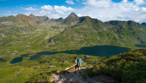 Hiker on the way to the mountain hut Ignaz-Mattis-Hutte