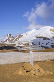 Signposts behind mountain Loomundur Fannborg and Snaekollur