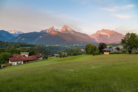Watzmann massif and Hochkalter in the morning light in front of alpine meadows