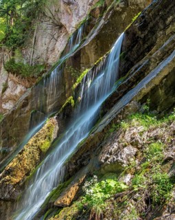 Waterfall on mossy slope