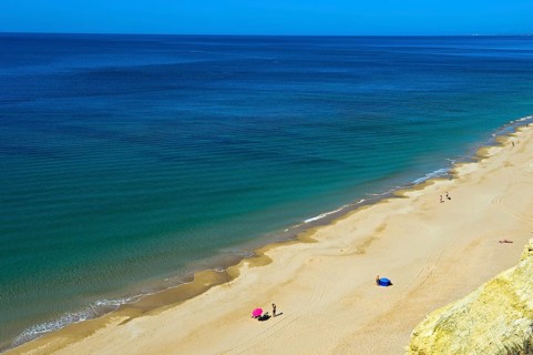Long empty sandy beach in the Algarve