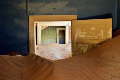 Desert sand in the ruined building of the former diamond city