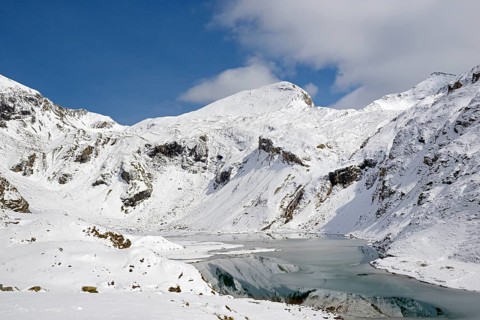 Nassfeld reservoir at 2233 m on the Grossglockner High Alpine Road with snowy mountains