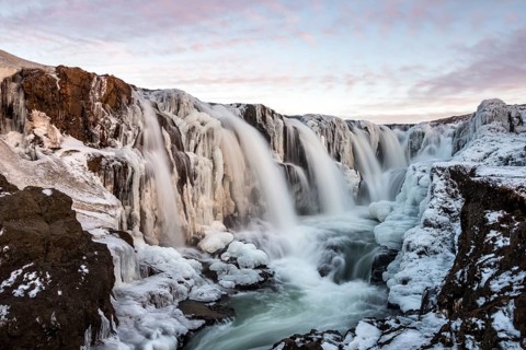 Waterfall with ice and snow in winter