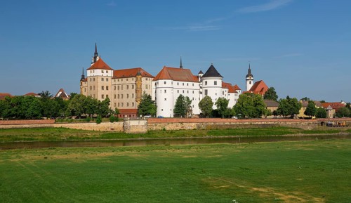 Hartenfels Castle and municipal church St.Marien with Elbe