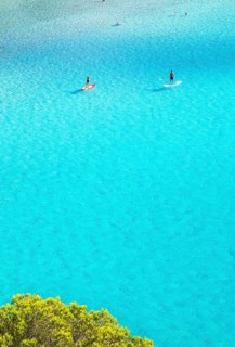 People paddleboarding