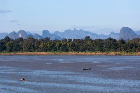 View over the border river Mekong to karst mountains in Laos