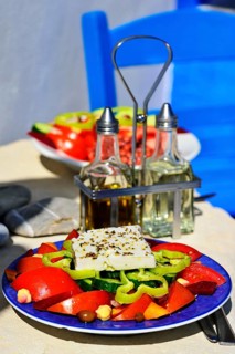 Greek salad with sheep cheese served on plate