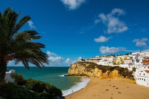 Bay with beach and colourful houses