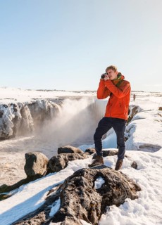 Photographing Man at Selfoss Waterfall in Winter