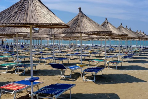 Parasols and sun loungers on the beach in Fushe-Drac near Durres