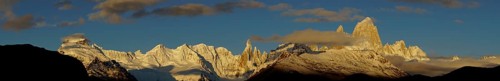 Snow-covered mountain range with Cerro Torre and Fitz Roy at sunrise