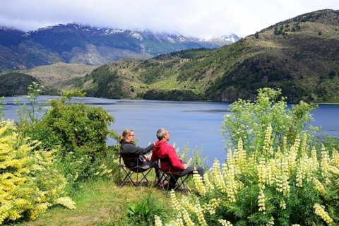Couple on camping chairs at Lago Tranquilo