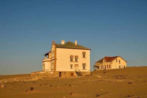 Decaying houses of the accountant and mine manager of the former diamond town Kolmanskop