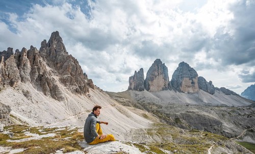 Hiker sits on rock