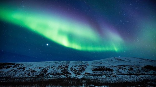 Northern Lights (Aurora borealis) over mountains