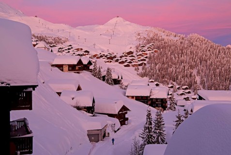Village view snow-covered at dusk