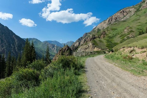 Gravel Road through mountains across Naryn gorge