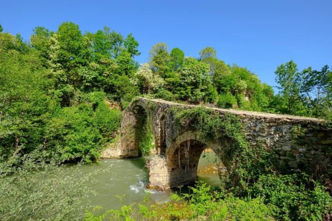 Old Ottoman stone arch bridge Ura e Golikut over river Shkumbin