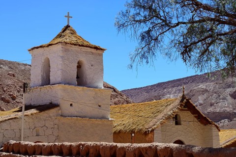 Church in the Adobese style with thatched roof