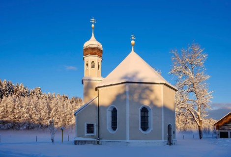 Snow-covered Nikolauskapelle in the morning light