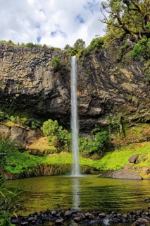 Wall of columnar basalt with waterfall Bridal Veil Falls