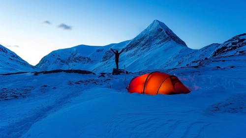 Tent with person in the snow