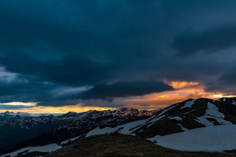 Sunrise over South Tyrolean mountains with dramatic clouds