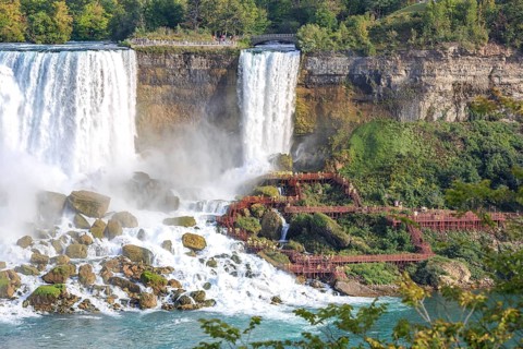 Tourists in front of waterfall