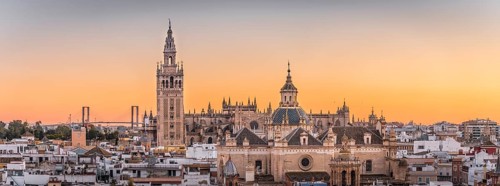 City view with views of La Giralda and Iglesia del Salvador at sunset