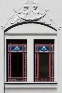 Relief and stained-glass windows on a town house